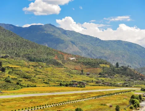 panoramic-view-airport-paro-valley-bhutan-landscape-mountain-river-green-meadows-agricultural-land-blue-sky-301823571
